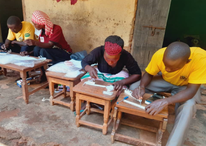 Ugandan community health workers prepare specimens for VectorCam analysis during routine mosquito surveillance Ugandan community health workers prepare specimens for VectorCam analysis during routine mosquito surveillance